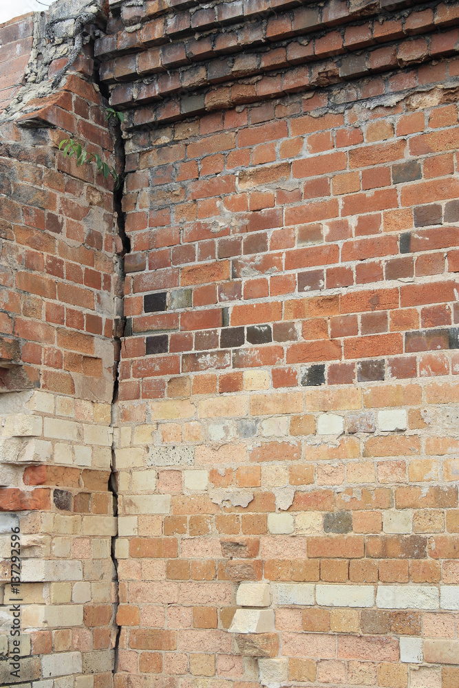 cracked old building brick wall with eroded bricks cracked old building brick wall with eroded bricks