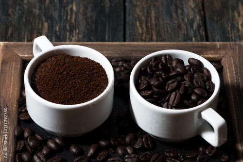 ground coffee and coffee beans in cups