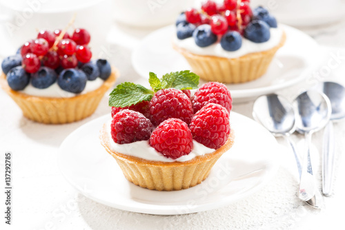 mini tarts with cream and berries