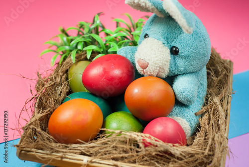 decorating Easter bunny and colorful Easter eggs