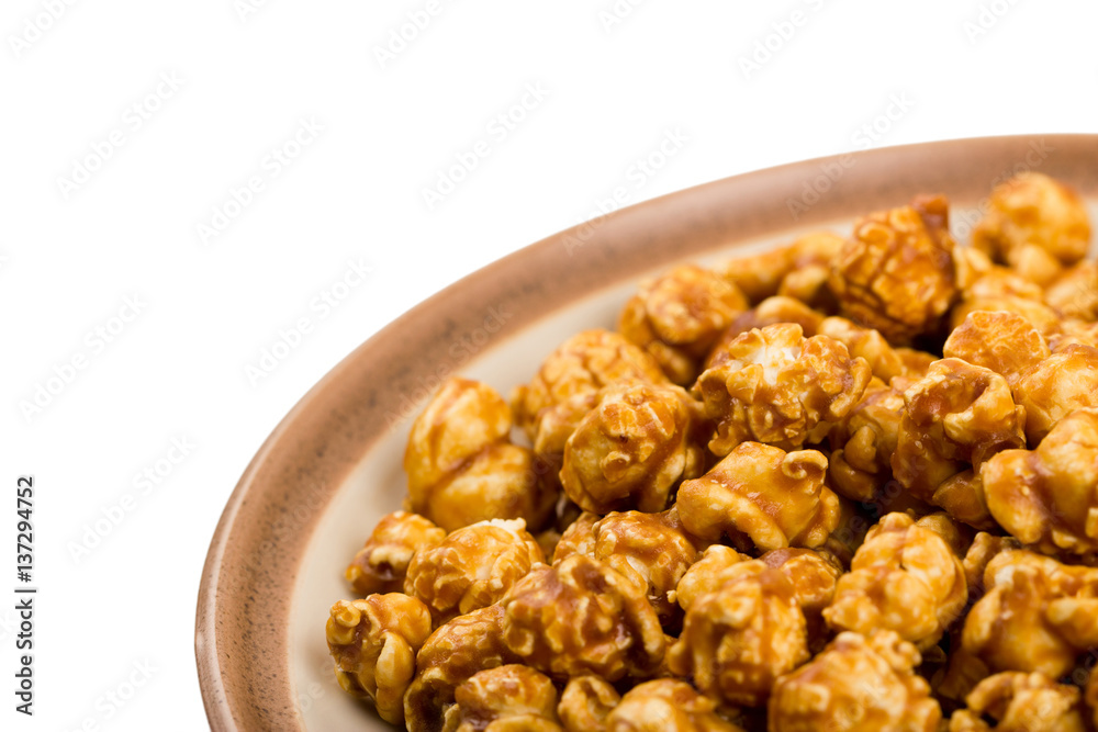 caramel popcorn on a plate macro isolated caramel popcorn on a plate macro isolated