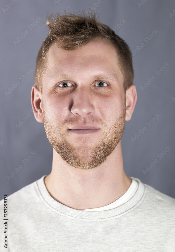 Fototapeta premium Portrait of the young smiling man