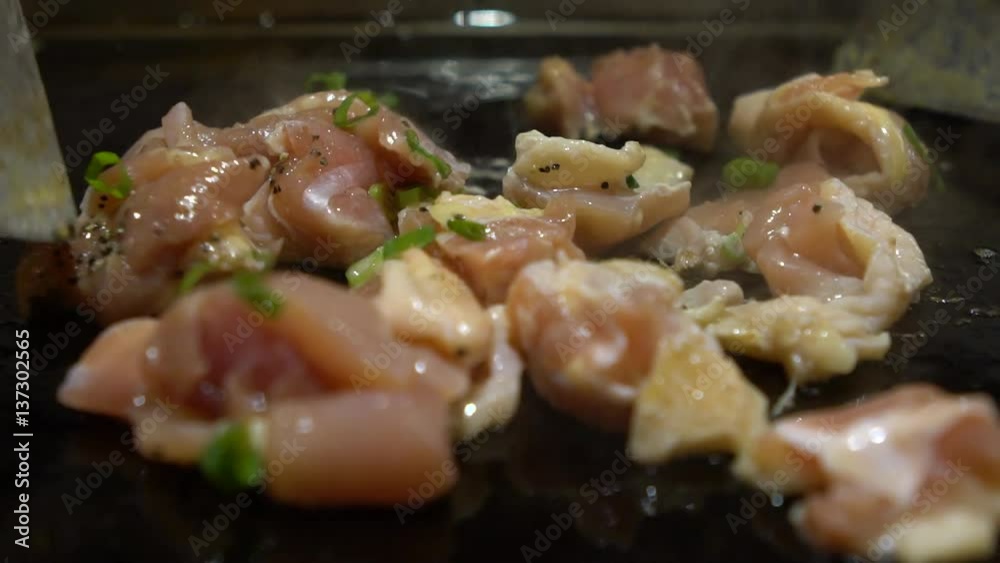 Slow Motion Cuisine a small Piece of chiken. A Chef is Cooking a Raw chiken Meat Steak on the Grill in a kitchen restaurant. Cooked indoors closeup Slow-Motion rate of 120 fps-Dan Slow Motion Cuisine a small Piece of chiken. A Chef is Cooking a Raw chiken Meat Steak on the Grill in a kitchen restaurant. Cooked indoors closeup Slow-Motion rate of 120 fps-Dan