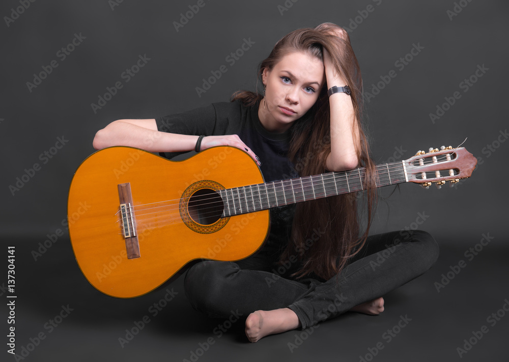 girl with an acoustic guitar girl with an acoustic guitar