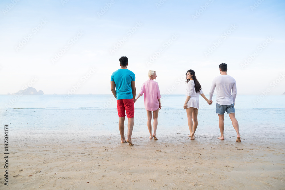 Young People Group On Beach Summer Vacation, Friends Walking Seaside Back Rear View Sea Ocean Holiday Travel