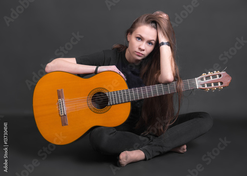 girl with an acoustic guitar