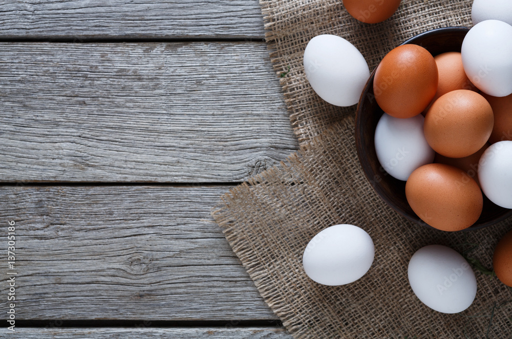 Fresh chicken brown eggs on sack, organic farming background Fresh chicken brown eggs on sack, organic farming background