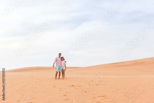 Young Man Woman In Desert Beautiful Couple Asian Girl And Guy Embrace Sand Dune Landscape Background