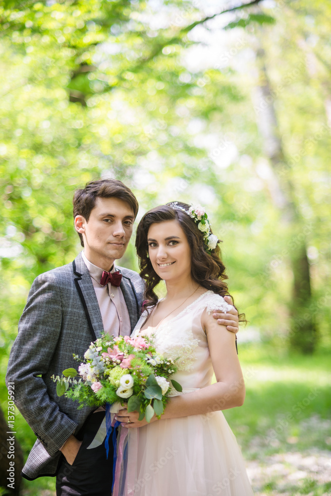 groom and bride outdoor back view