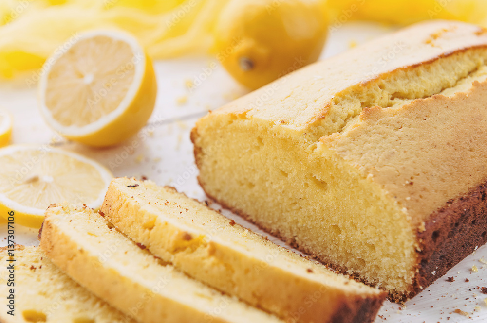 lemon cake with fruits on white wooden surface lemon cake with fruits on white wooden surface