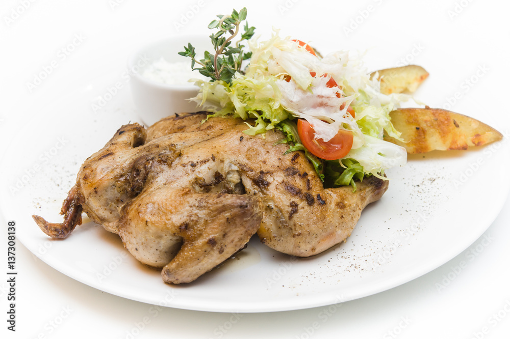 delicious grilled chicken with a side dish of vegetables and herbs