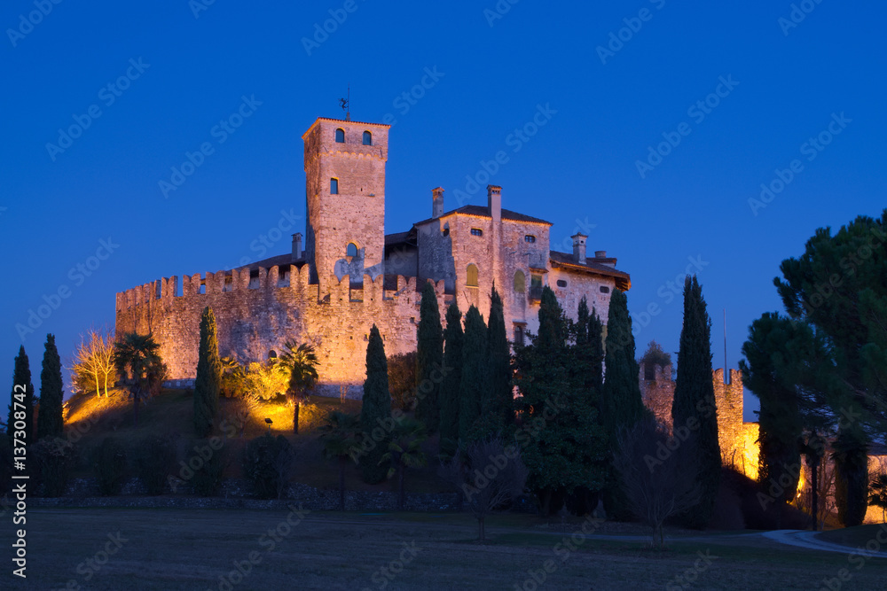 Castle of Villalta with the tower of Fagagna and the Alps in the background during the blue hour after the sunset, Friuli, Italy


