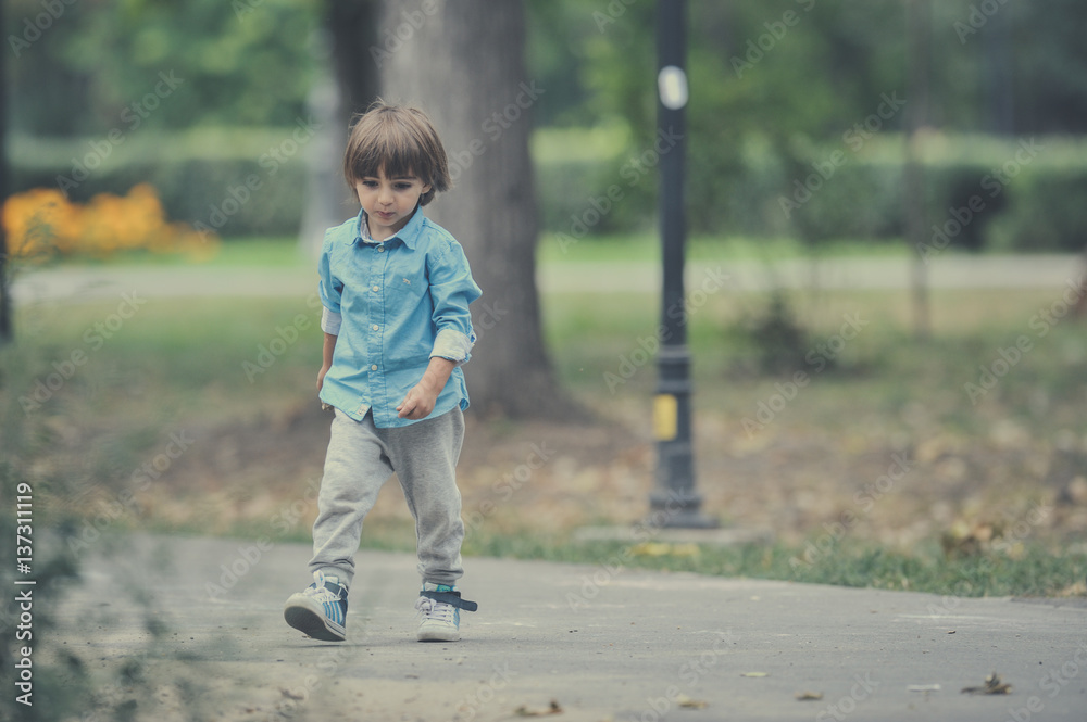 Cute young child boy or kid playing Cute young child boy or kid playing