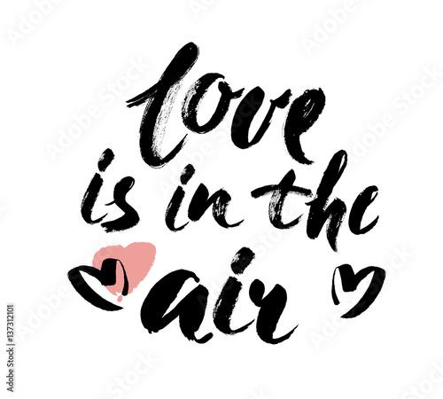 Love is in the air hand lettering. Hand drawn card design. Brush Lettering Design. Vector illustration