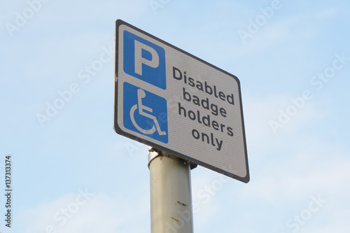 Disabled badge holders only - parking sign