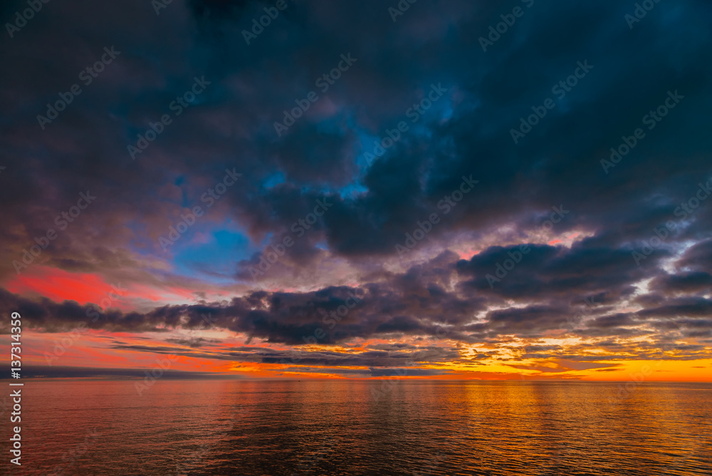 Colorful dramatic sunset above Glenelg Beach