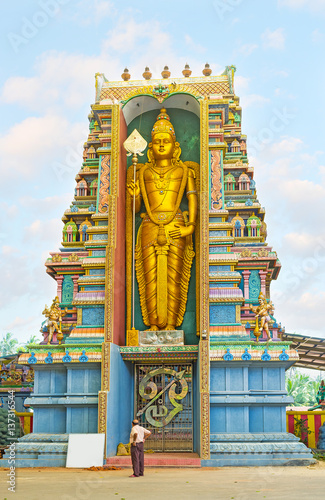 The golden statue of Murugan photo