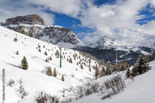 Sunny view of Dolomites from Belvedere valley near Canazei of Val di Fassa, Trentino-Alto-Adige region, Italy.
