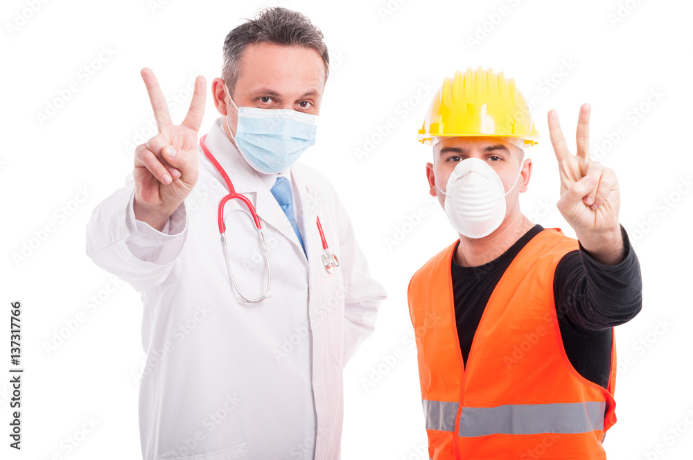 Doctor and constructor showing peace gesture