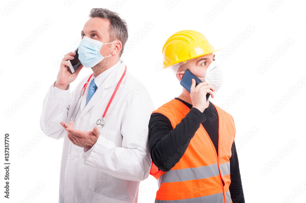 Doctor and constructor speaking at telephone making gestures Doctor and constructor speaking at telephone making gestures