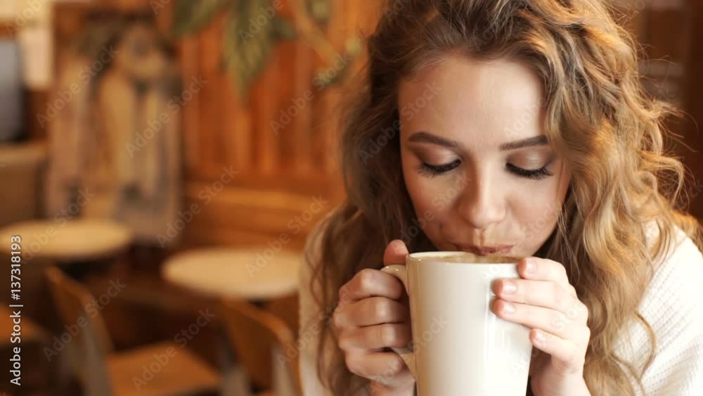 custom made wallpaper toronto digitalHappy girl drinking coffee and relaxing in cafe, smiling and looking at camera. Beautiful woman with cup of coffee sitting in the coffee shop