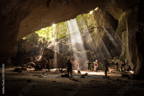 Tourists in rainforest cave in Taman Negara, Malaysia