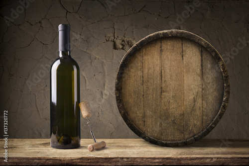 White wine with barrel on vineyard in Chianti, Tuscany, Italy