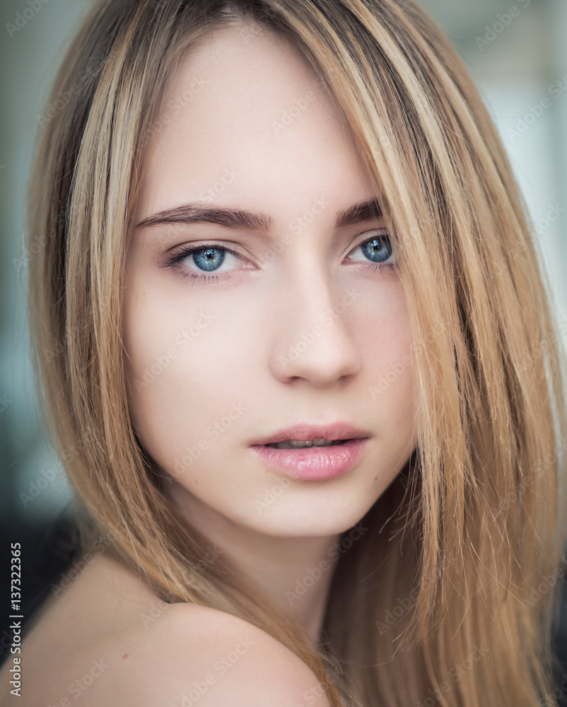 Portrait of a beautiful young woman with blue eyes. Portrait of a beautiful young woman with blue eyes.