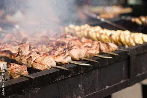 BBQ meat and potato on grill