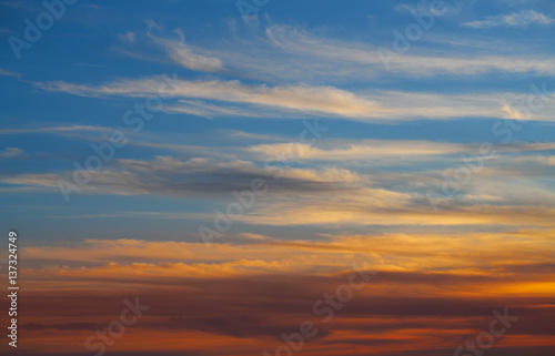 Sunset sky orange clouds over blue © lunamarina