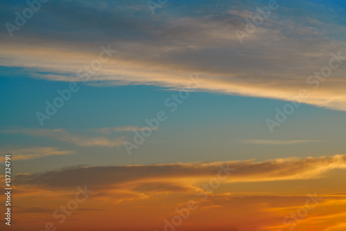 Sunset sky orange clouds over blue © lunamarina