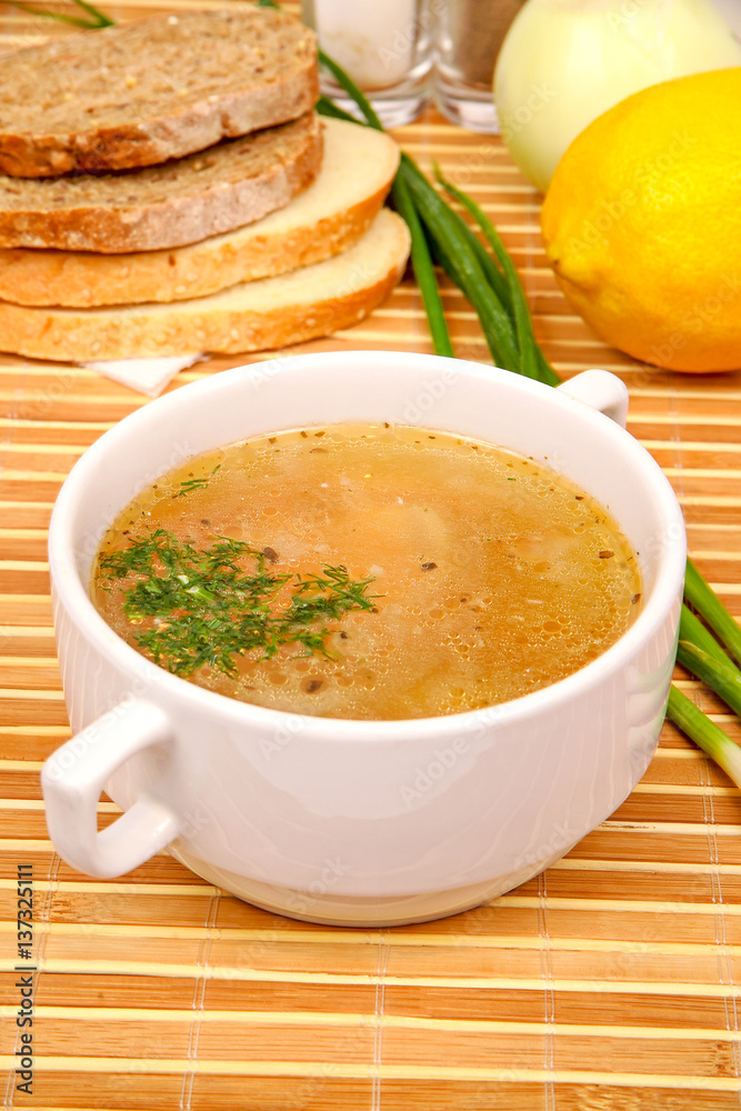 fish soup with parsley in the white plate fish soup with parsley in the white plate
