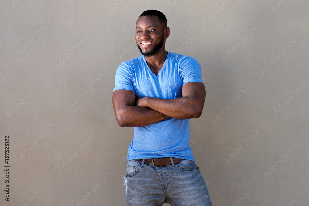 handsome man with beard smiling with arms crossed handsome man with beard smiling with arms crossed
