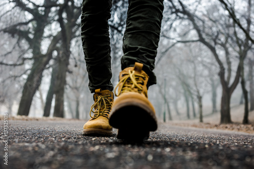 hiking boots and jeans walking