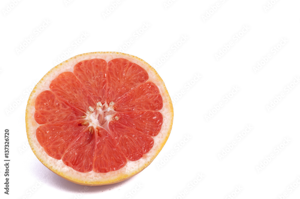 Fresh grapefruit cut in half isolated over the white background, top view Fresh grapefruit cut in half isolated over the white background, top view