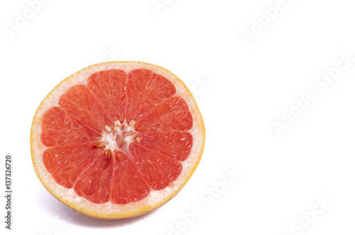 Fresh grapefruit cut in half isolated over the white background  top view