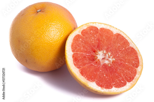One and a half cut grapefruit isolated on white background