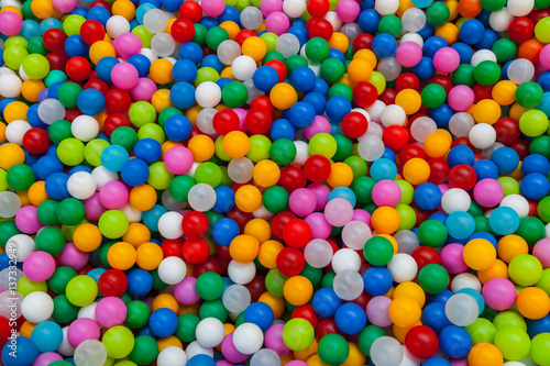 Colored plastic toy balls of different color for the children s pool dry. View from afar. Picture background  wallpaper  texture  pattern.