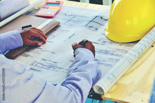 Wallpaper Mural Architect drawing on architectural project business, architecture, building, construction and people concept - close up of architect hands with compass measuring living house blueprint Torontodigital.ca