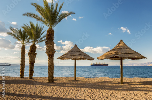   Morning at sandy beach of Eilat - famous resort and recreation city in Israel  