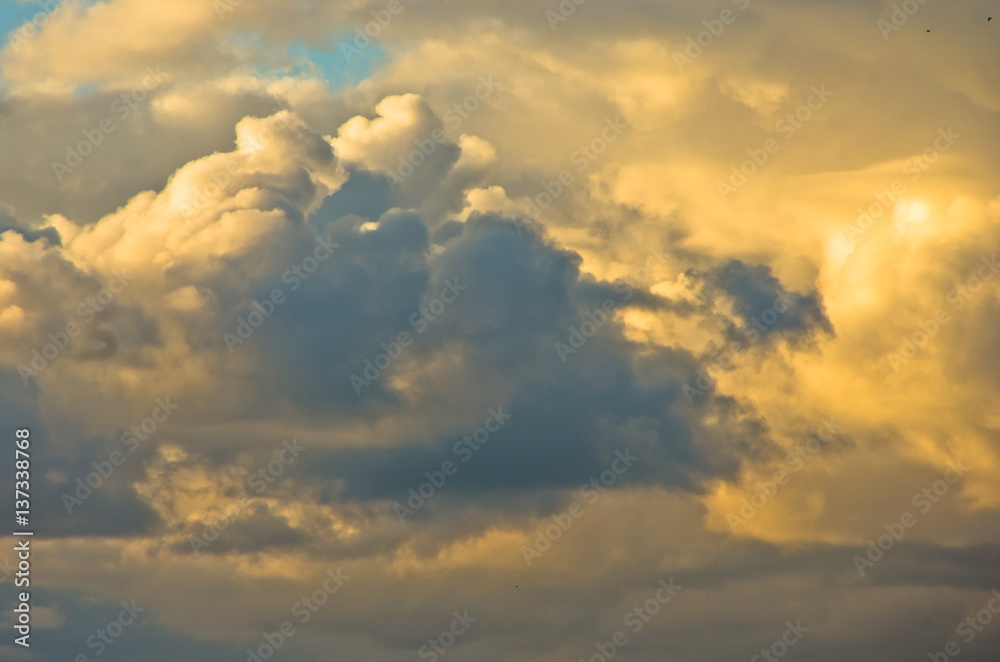 Colorful and picturesque golden clouds at sunset Colorful and picturesque golden clouds at sunset
