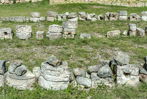 remains with Mayan reliefs of the palace of the masks or Codz Poop in the archaeological Kabah enclosure in Yucatan, Mexico. photo