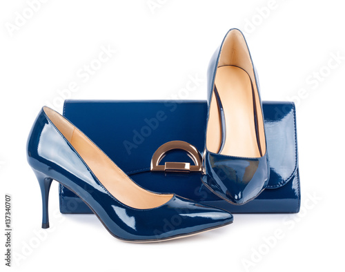 Beautiful blue shoes with clutches on isolated background
