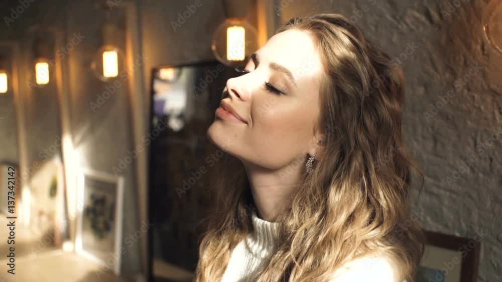 Attractive girl, sun is shining. Young attractive woman in the rays of the sun Attractive girl, sun is shining. Young attractive woman in the rays of the sun