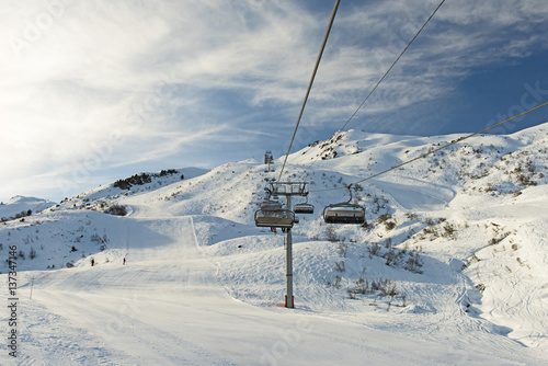View of an alpine ski slope with chairlift