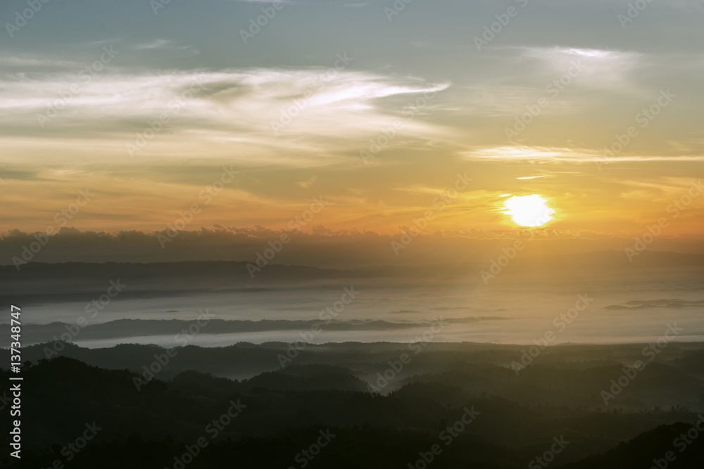 Fototapeta premium Cloudy skies and stunning hilltop in winter.