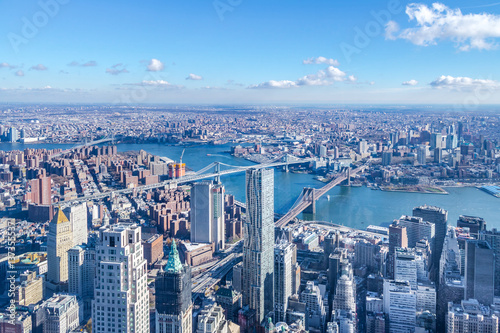 Fotografie, Tablou Skyline aerial view of Manhattan with skyscrapers, East River, Brooklyn Bridge a