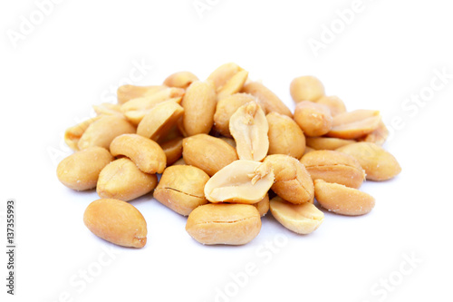 arranged peanuts peeled and isolated on white background