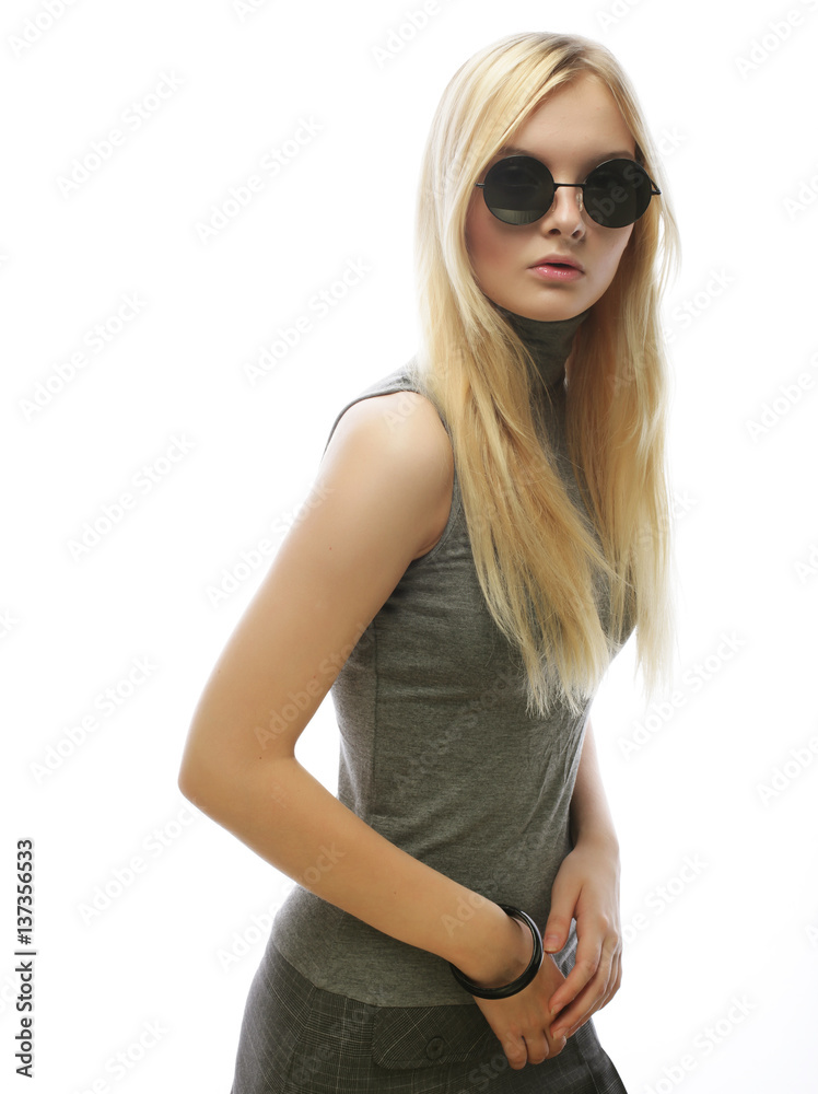Fototapeta premium Beauty stylish blonde woman posing in fashionable clothes and bi