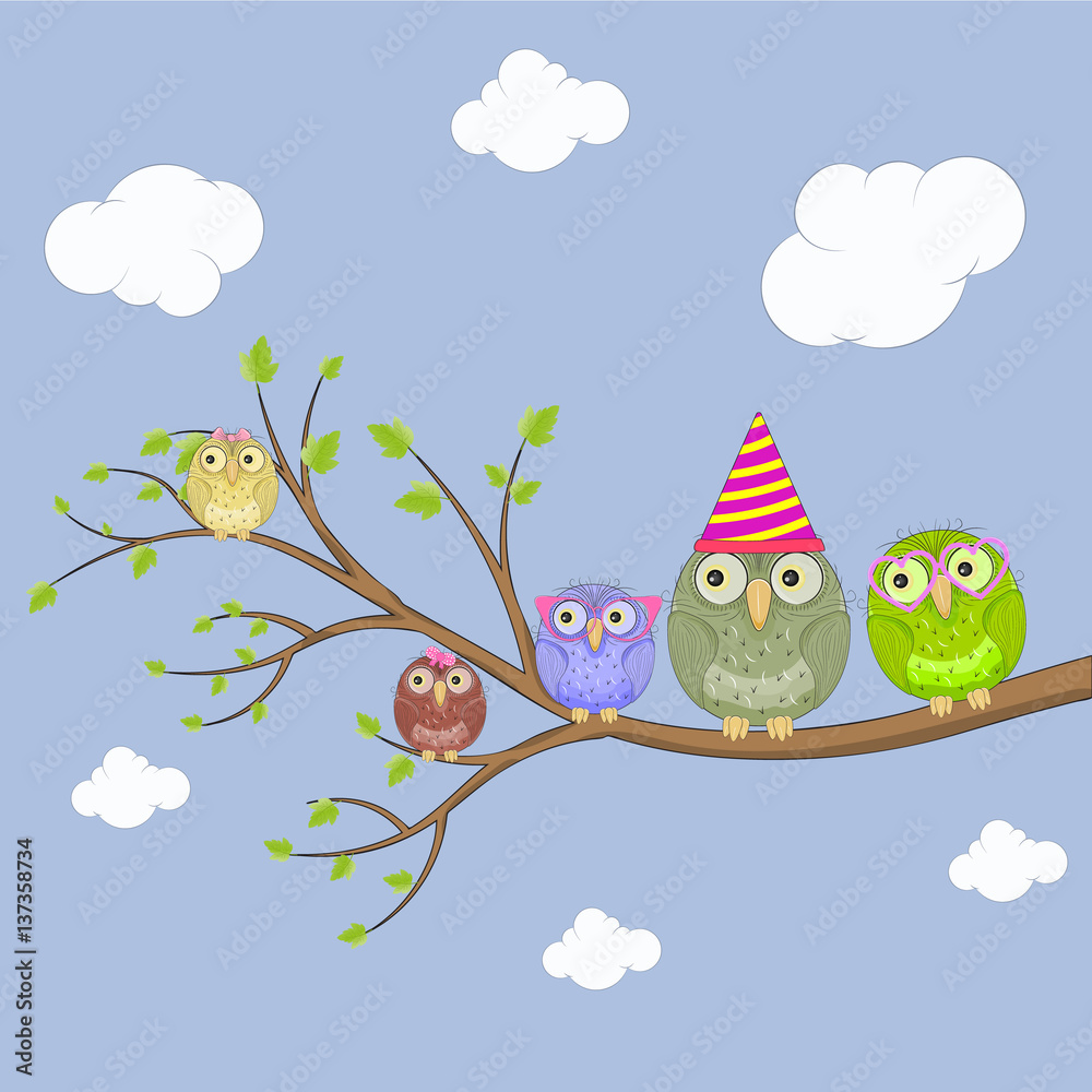 Cute owl sitting on a tree.
